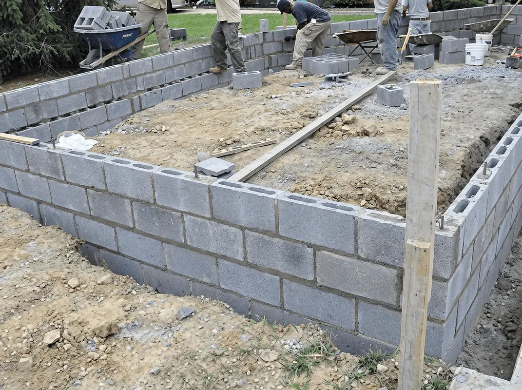 Professionals building a foundation with blocks in Dover, DE